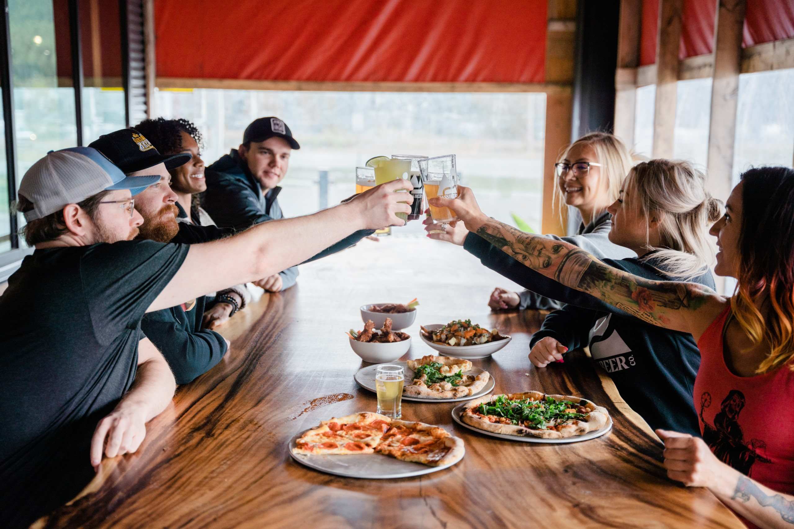 People sharing food and drinks at a local restaurant